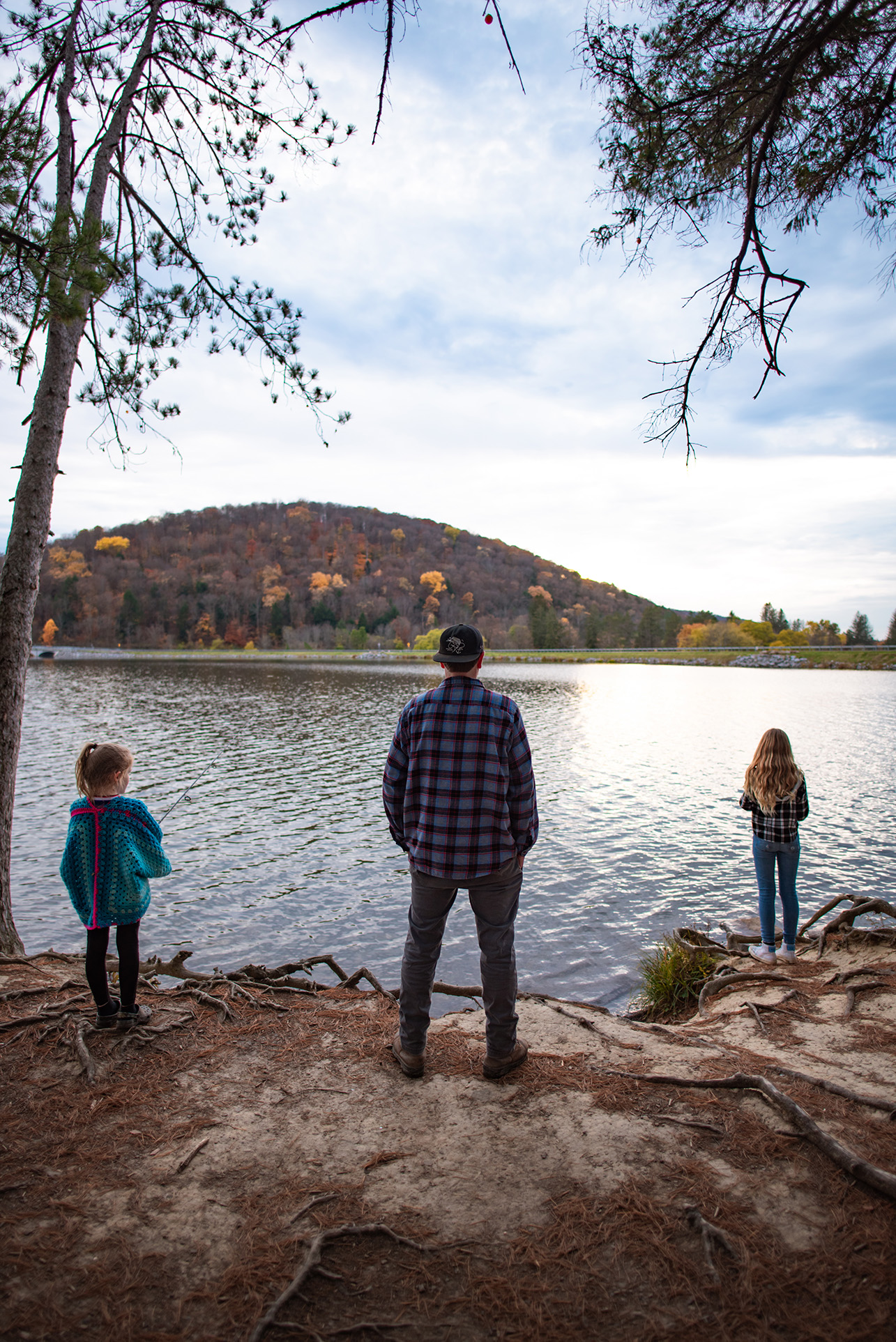 Family looking out over Red House Lake at Allegany State Park in Autumn