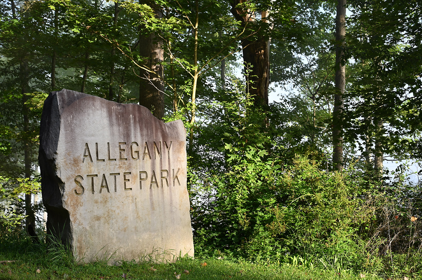 Stone with the words "Allegany State Park" at the eastern Salamanca entrance